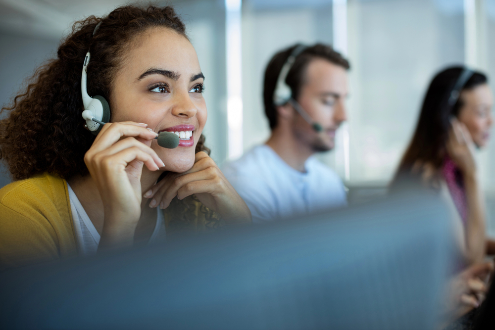 Inbound customer service professionals at InfoCision applying customer retention strategies to resolve customer issues and build long-term loyalty