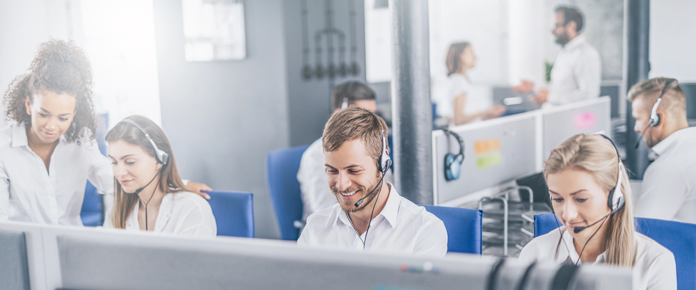 Professional customer service representative at InfoCision using advanced call center software to support existing customers efficiently
