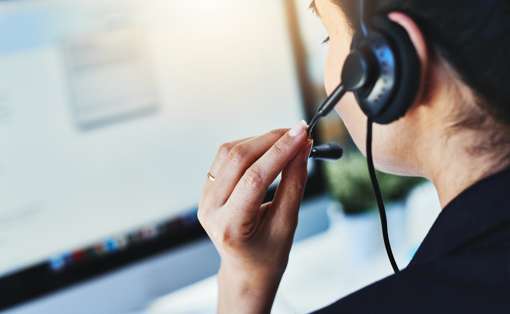 Hand, headset or woman with mic, call centre or help desk for advice, telemarketing or insurance info. Person, closeup or employee in office, system check for client or technician response deployment CRM dashboard organizing donor segments and giving levels to personalize outreach after a supporter’s first gift