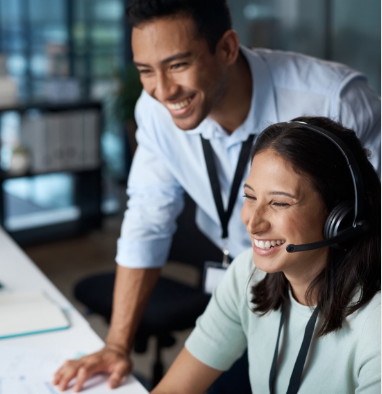 Supervisor Assisting Young Agent InfoCision supervisor guiding a young inbound customer support agent, ensuring accurate resolutions and exceptional customer service on every cal